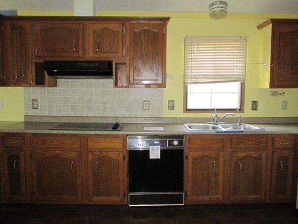36 Gould Road Ware, MA 01082 - Photo 3 of 30 a kitchen with granite countertop wood cabinets and a sink