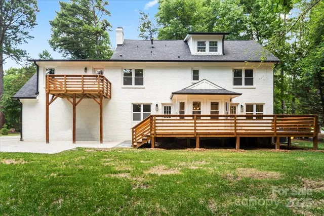 a front view of a house with a yard table and chairs