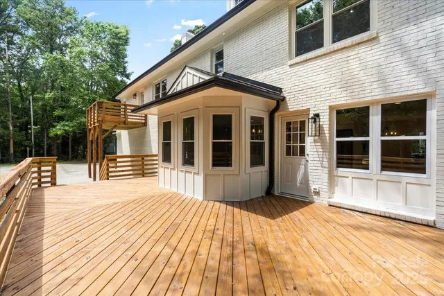 a front view of a house with a large window