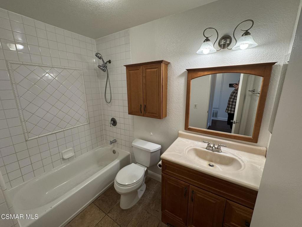 2263 Workman Avenue Simi Valley, CA 93063 - Photo 13 of 17 a bathroom with a sink double vanity granite tub and shower