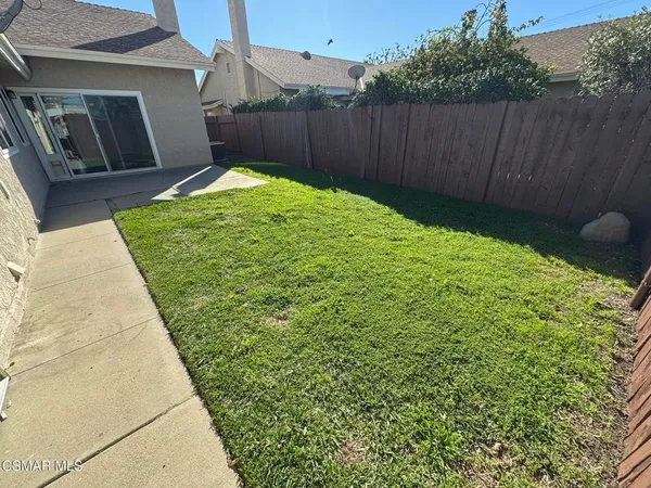 a view of backyard with green space