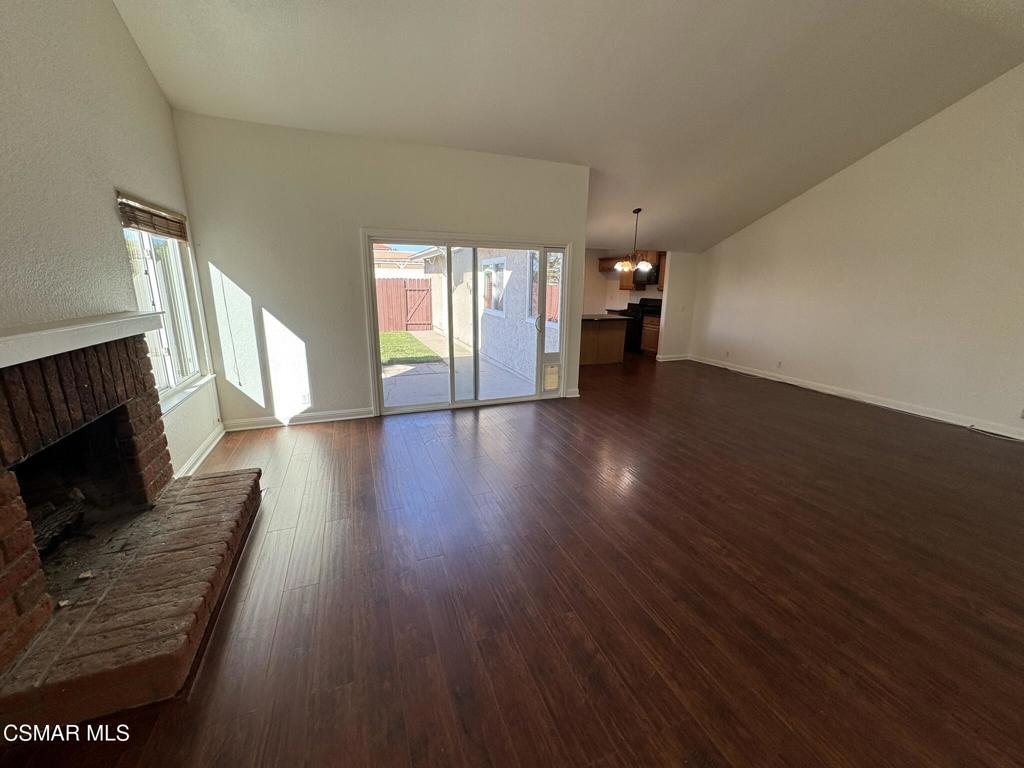 2263 Workman Avenue Simi Valley, CA 93063 - Photo 2 of 17 a view of a livingroom with wooden floor and a fireplace