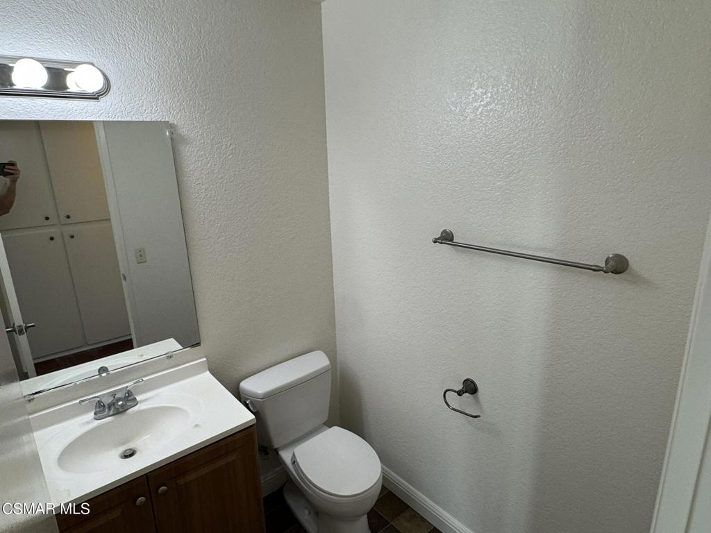 2263 Workman Avenue Simi Valley, CA 93063 - Photo 10 of 17 a bathroom with a sink mirror vanity and toilet