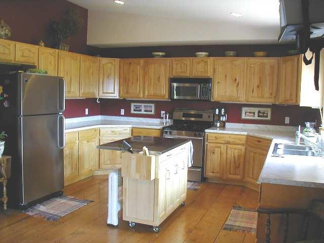1101 227th Road Rifle, CO 81650 - Photo 3 of 7 a kitchen with stainless steel appliances granite countertop a sink stove refrigerator and cabinets