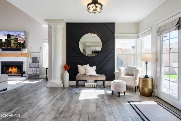 a living room with furniture and a fireplace