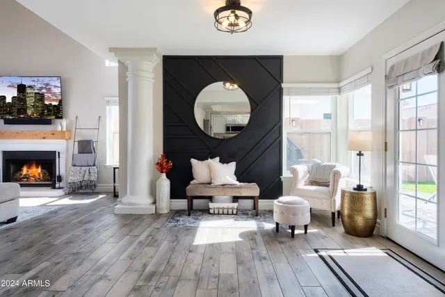 a living room with furniture and a fireplace