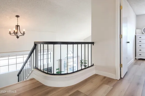 a view of staircase with wooden floor