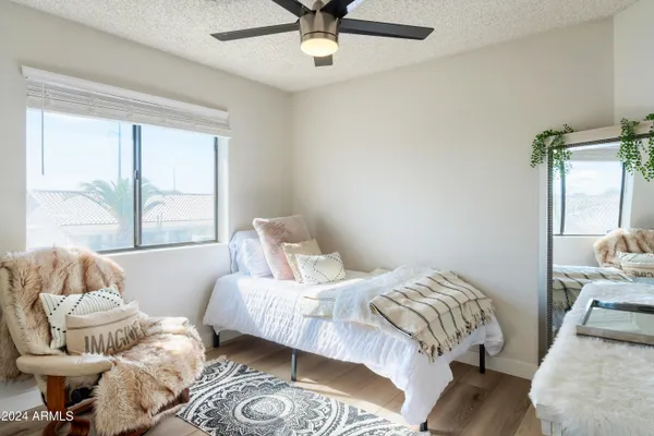 a bedroom with a bed and window