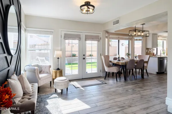 a view of a dining room with furniture window and outside view