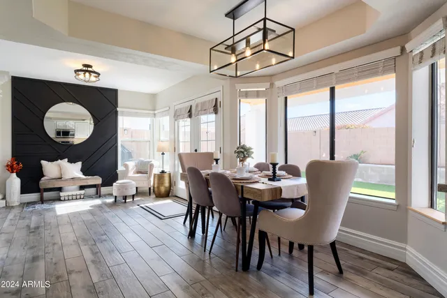 a view of a dining room with furniture window and wooden floor