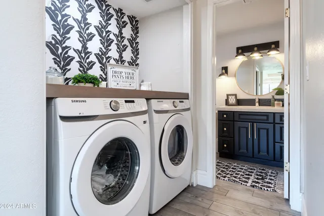 a bathroom with a sink a washer and dryer