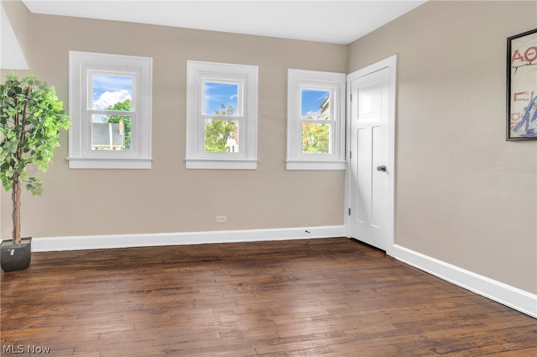 3218 Tullamore Road Cleveland, OH 44118 - Photo 17 of 42 Unfurnished room with dark wood-type flooring