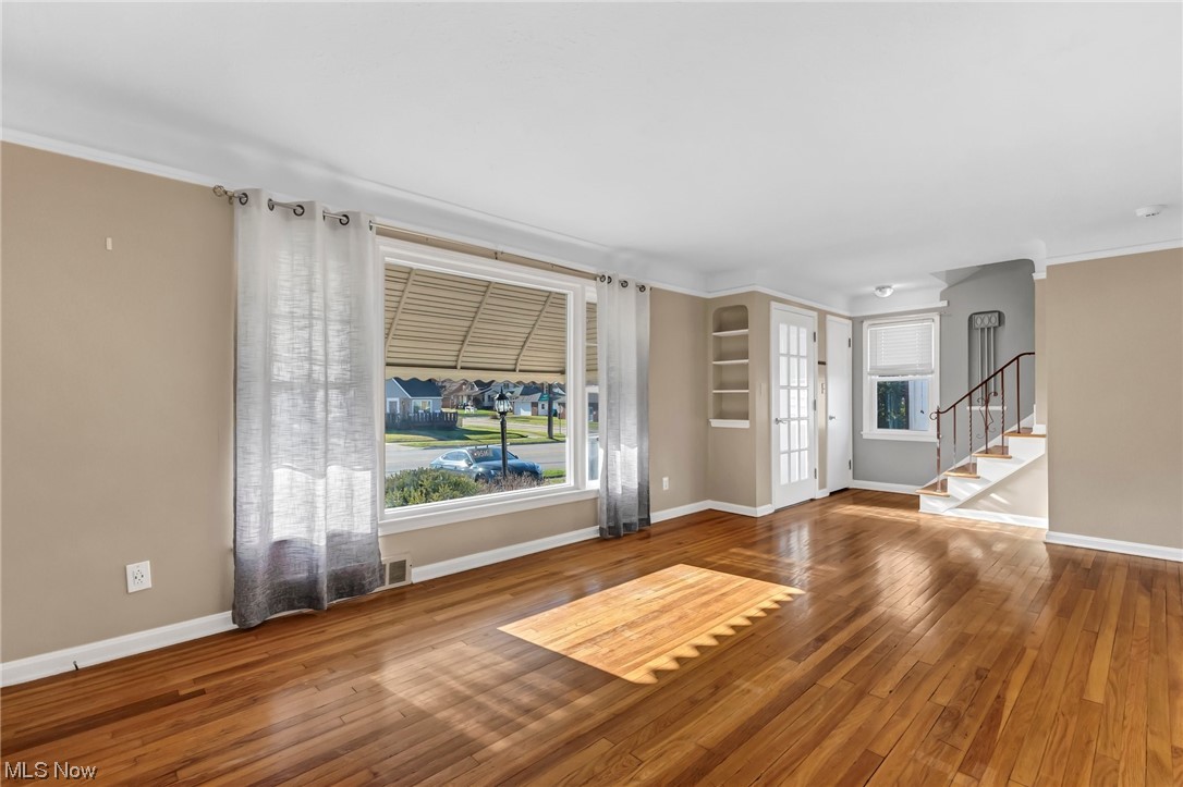 9516 Snow Road Cleveland, OH 44130 - Photo 2 of 40 Living room featuring ornamental molding and hardwood / wood-style floors