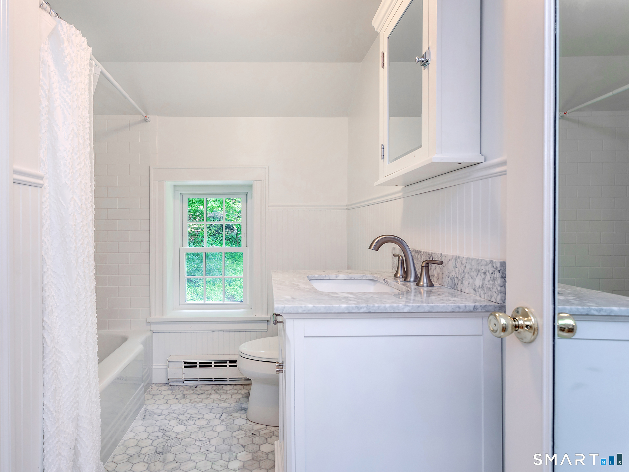 61 Curtiss Road Warren, CT 06777 - Photo 11 of 13 a bathroom with a sink and a window