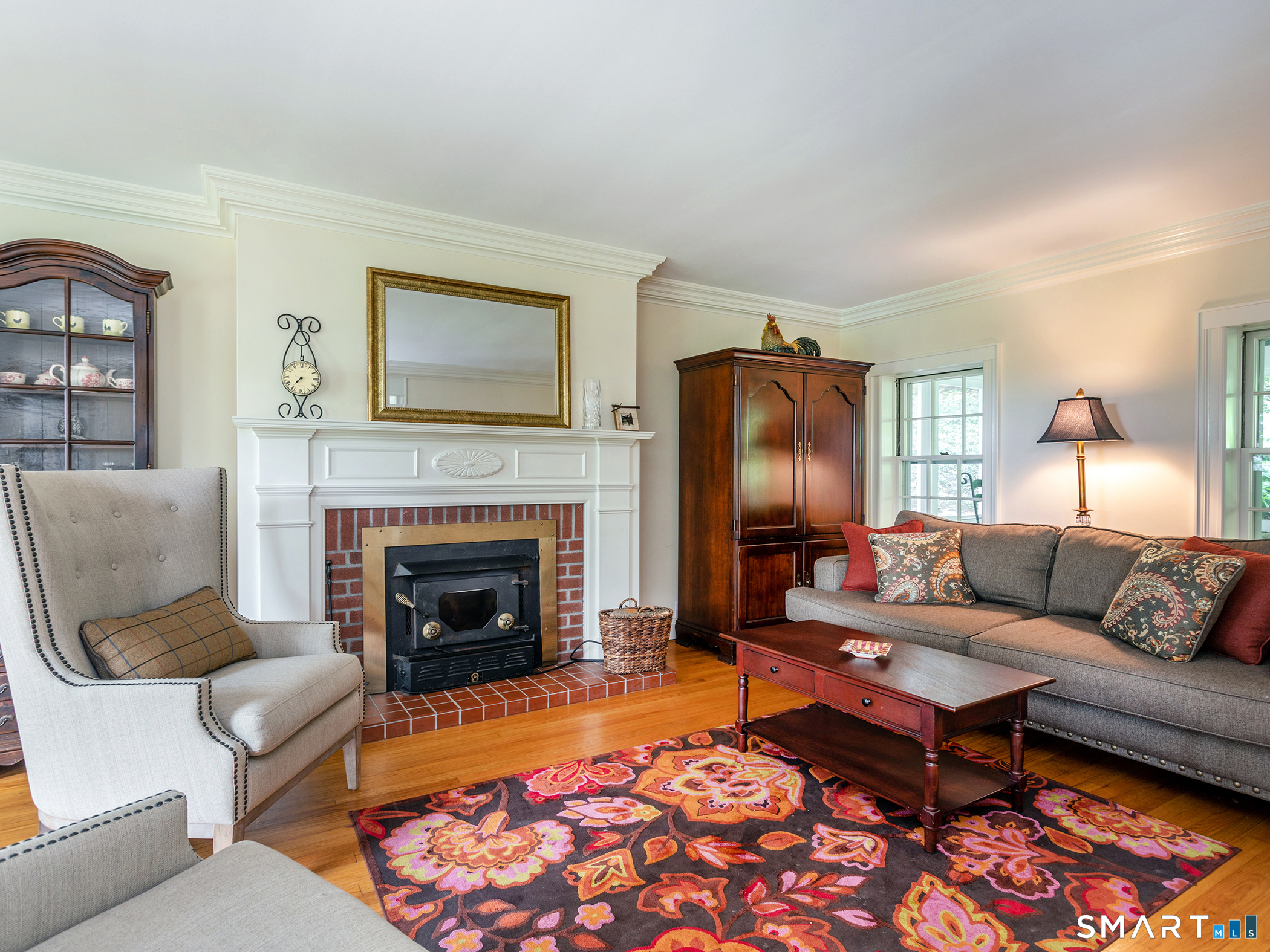 61 Curtiss Road Warren, CT 06777 - Photo 6 of 13 a living room with furniture and a fireplace