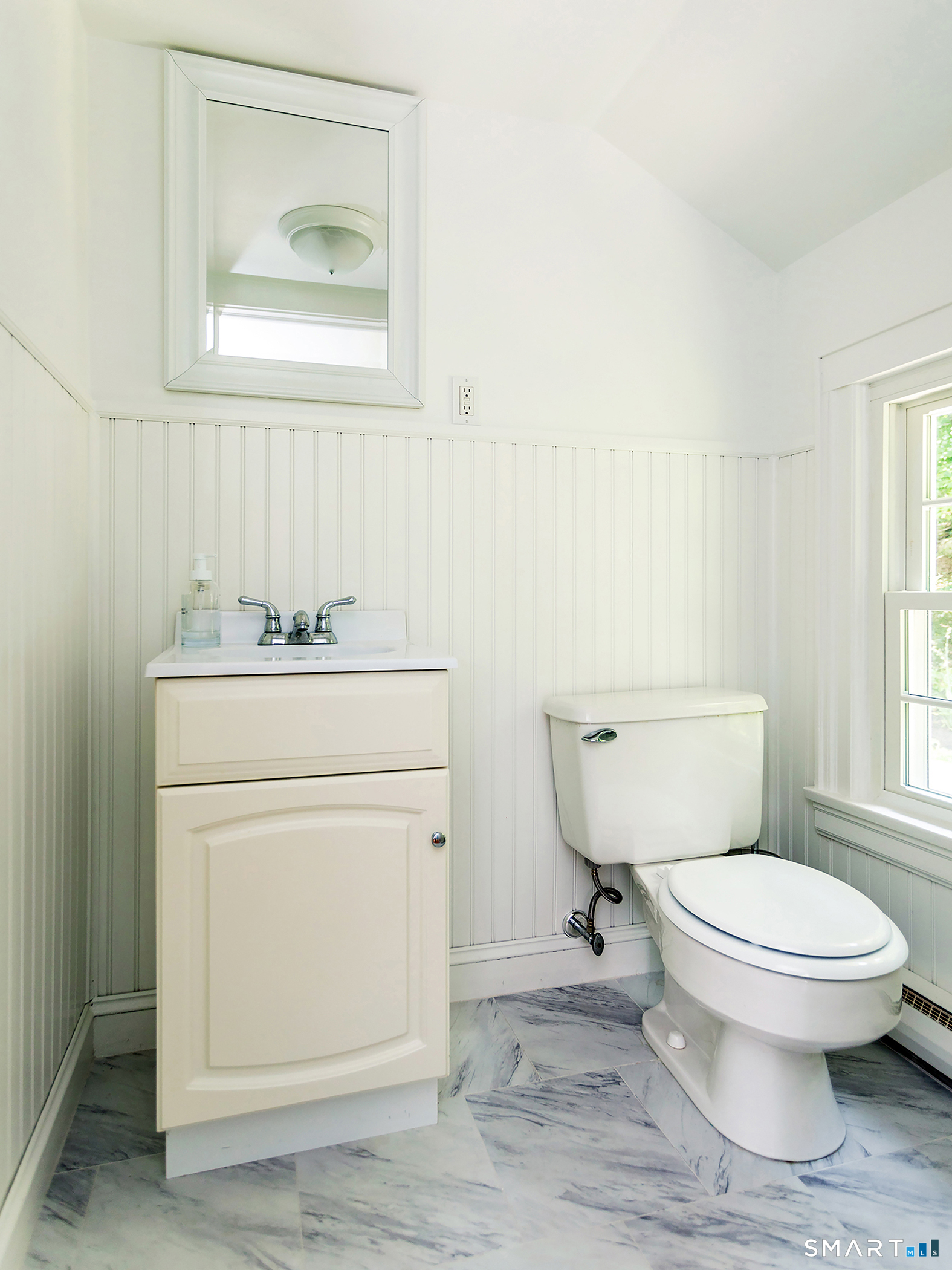 61 Curtiss Road Warren, CT 06777 - Photo 9 of 13 a bathroom with a toilet sink and mirror
