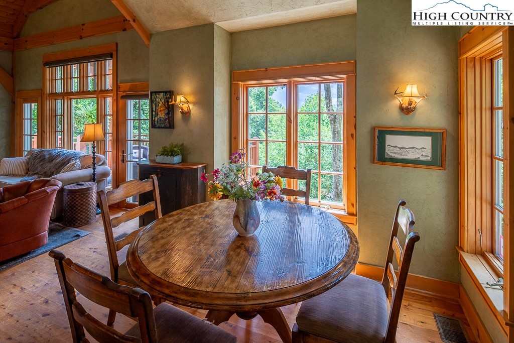 138 Mulberry Lane Boone, NC 28607 - Photo 13 of 33 a dining room with furniture a rug and wooden floor