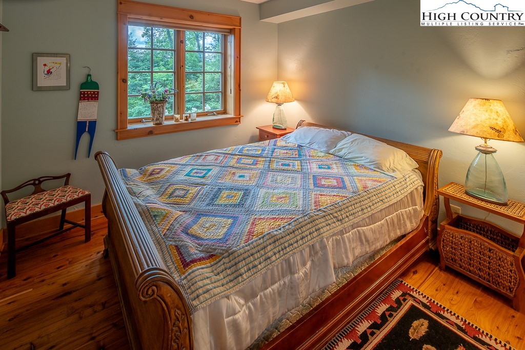 138 Mulberry Lane Boone, NC 28607 - Photo 21 of 33 a bedroom with a bed next to a window