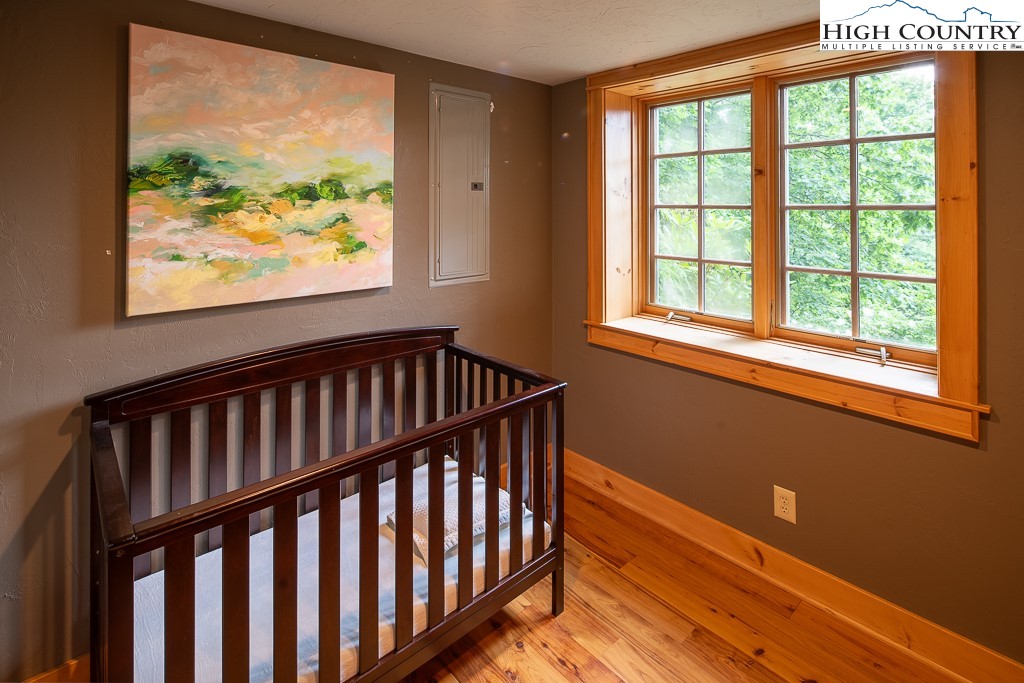 138 Mulberry Lane Boone, NC 28607 - Photo 24 of 33 a view of a hallway with wooden floor and a window