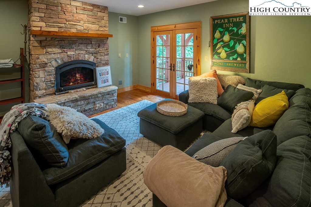 138 Mulberry Lane Boone, NC 28607 - Photo 26 of 33 a living room with furniture and a fireplace