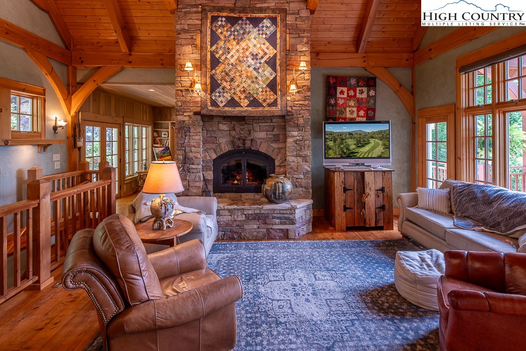 138 Mulberry Lane Boone, NC 28607 - Photo 4 of 33 a living room with furniture and a fireplace