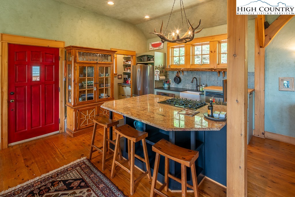 138 Mulberry Lane Boone, NC 28607 - Photo 9 of 33 a view of a dining room with furniture window and wooden floor