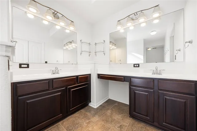 a kitchen with a sink cabinets and appliances