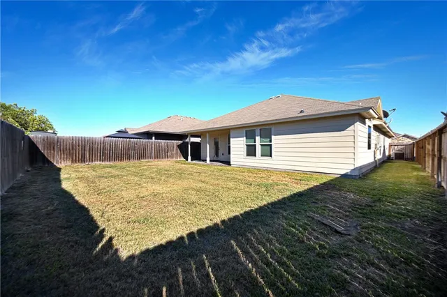 a house view with a garden space