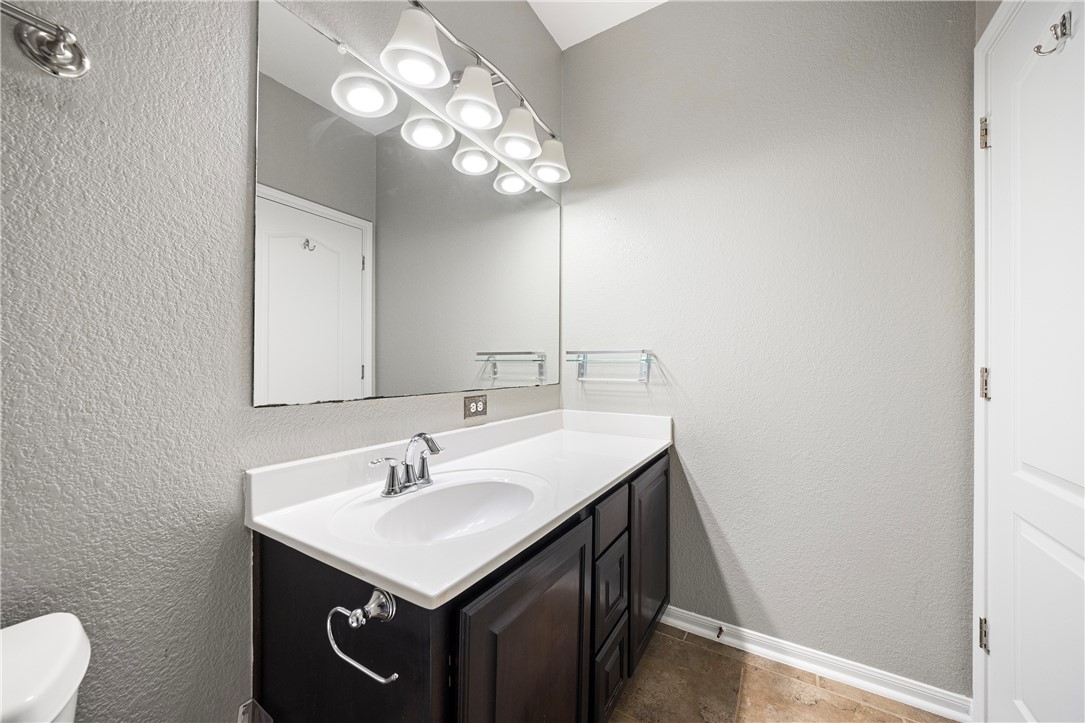 1022 Imperial Street Portland, TX 78374 - Photo 10 of 16 a bathroom with a sink vanity and a mirror