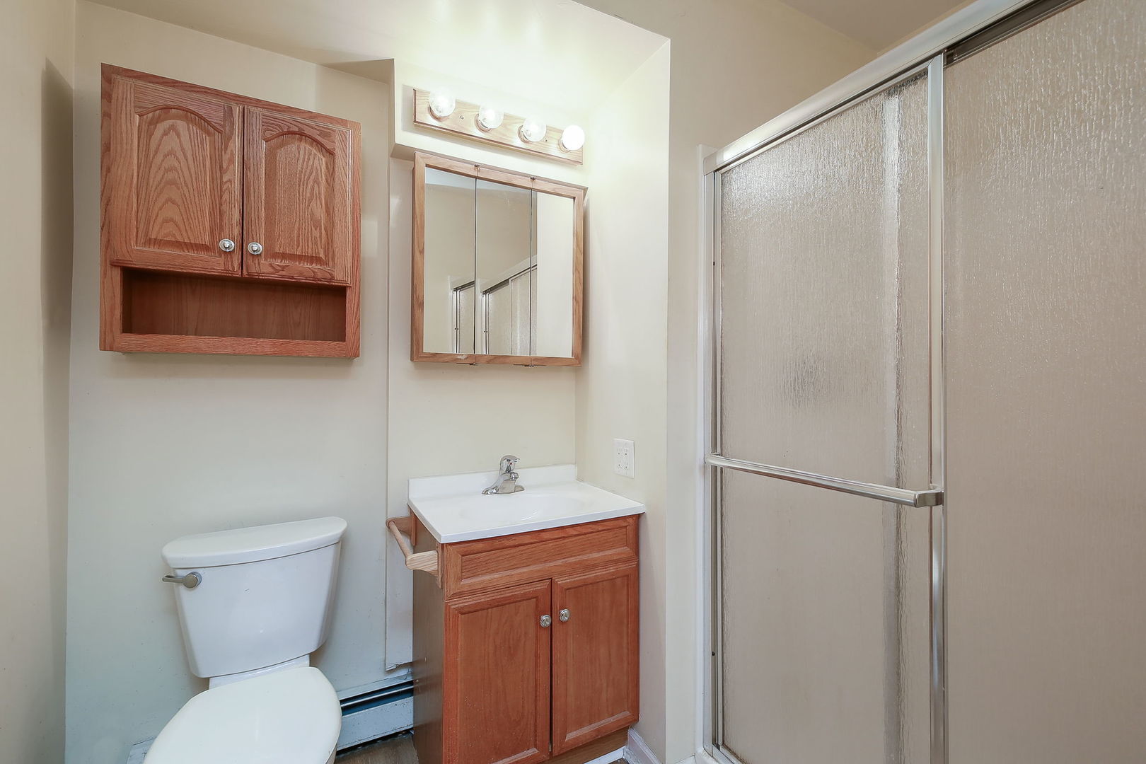 1170 South Broadway Road Montgomery, IL 60538 - Photo 15 of 25 a bathroom with a toilet sink and mirror