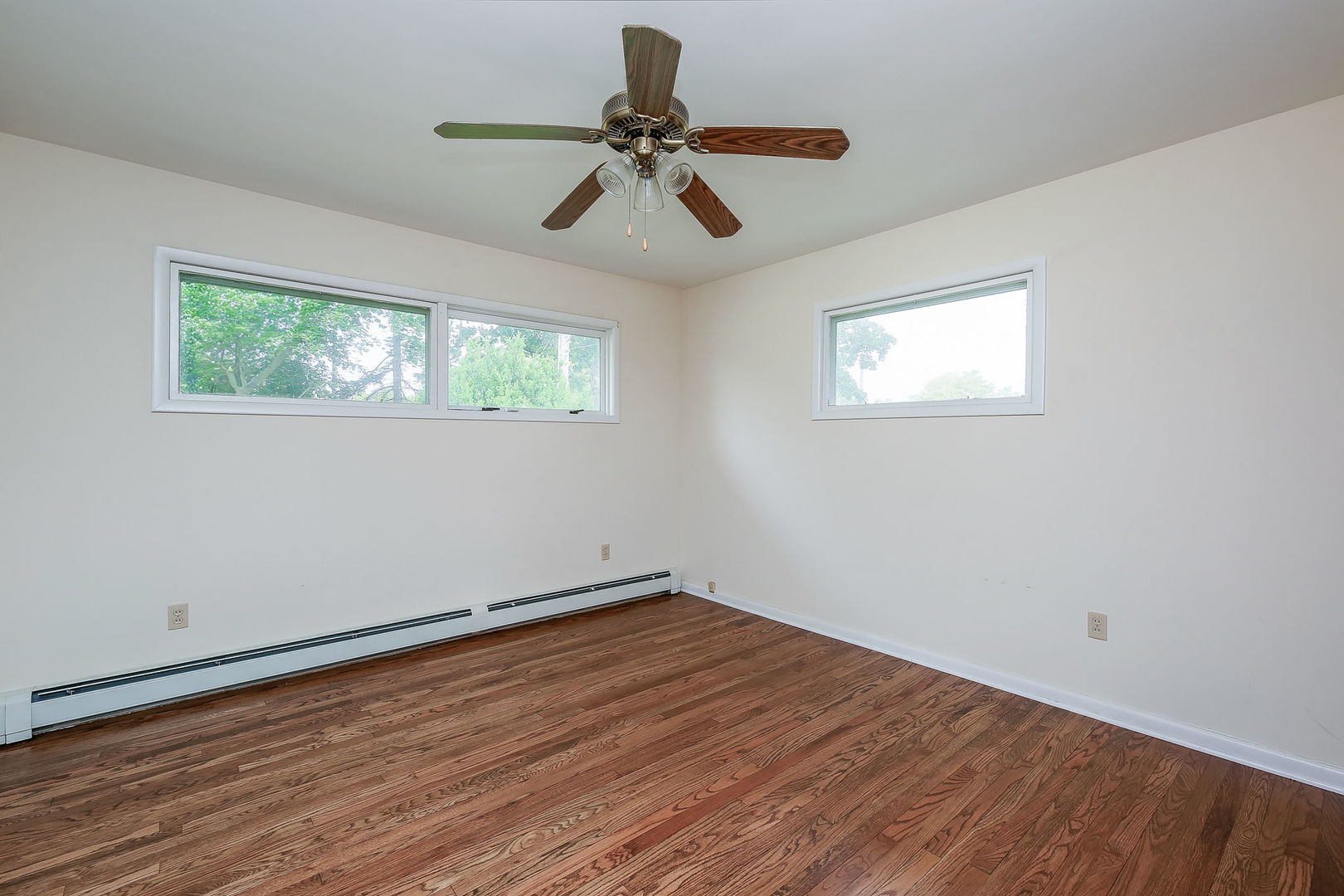 1170 South Broadway Road Montgomery, IL 60538 - Photo 16 of 25 a view of empty room with wooden floor and fan