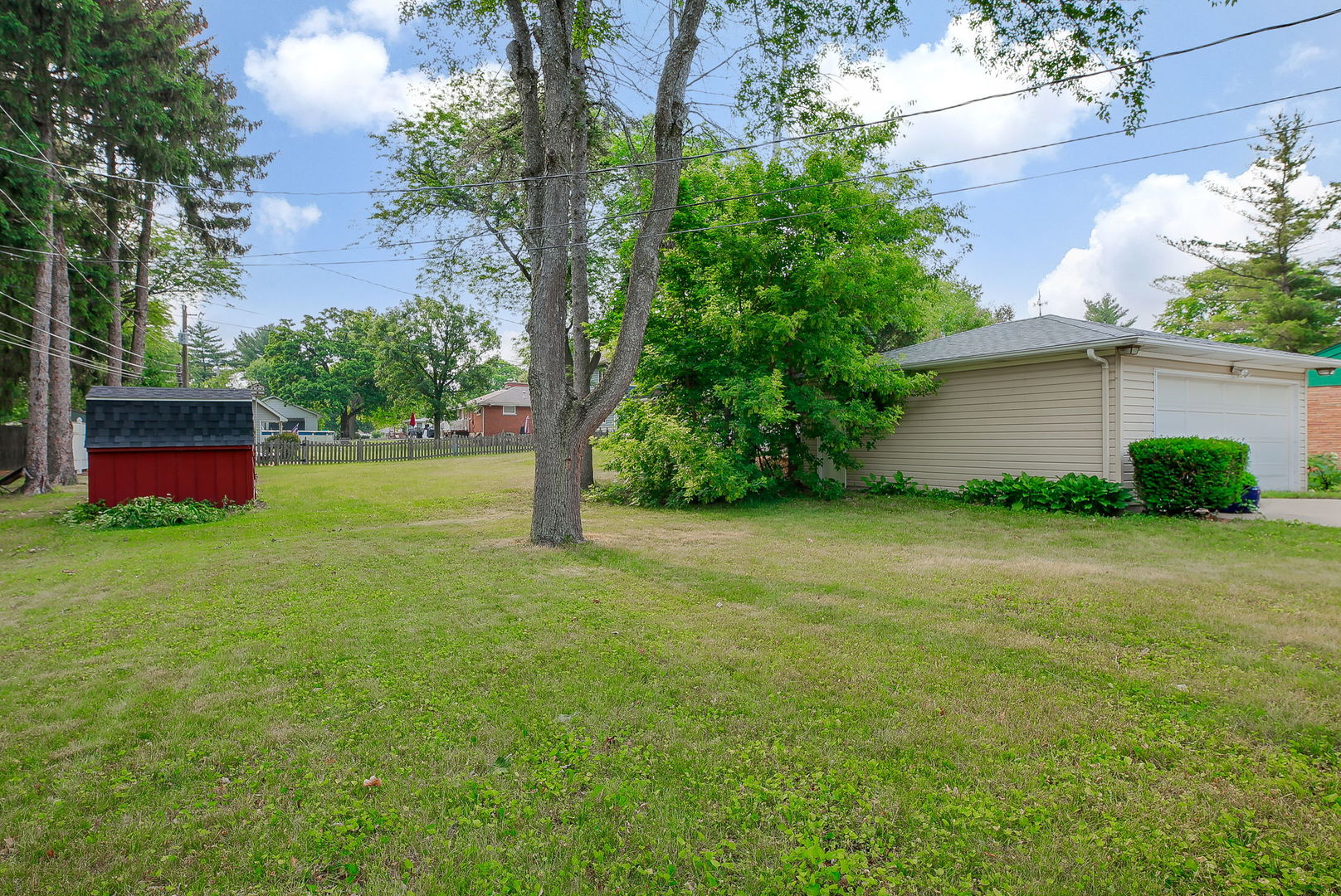 1170 South Broadway Road Montgomery, IL 60538 - Photo 24 of 25 a view of a backyard with large trees