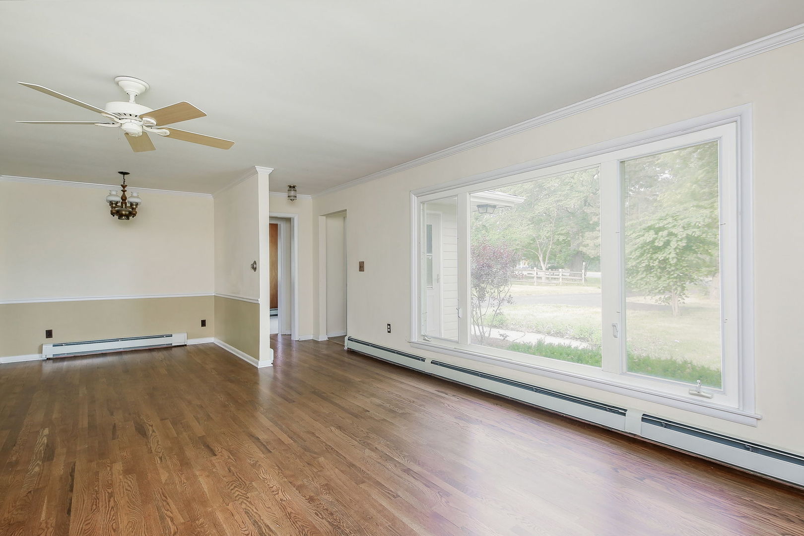 1170 South Broadway Road Montgomery, IL 60538 - Photo 4 of 25 a view of room with window and wooden floor