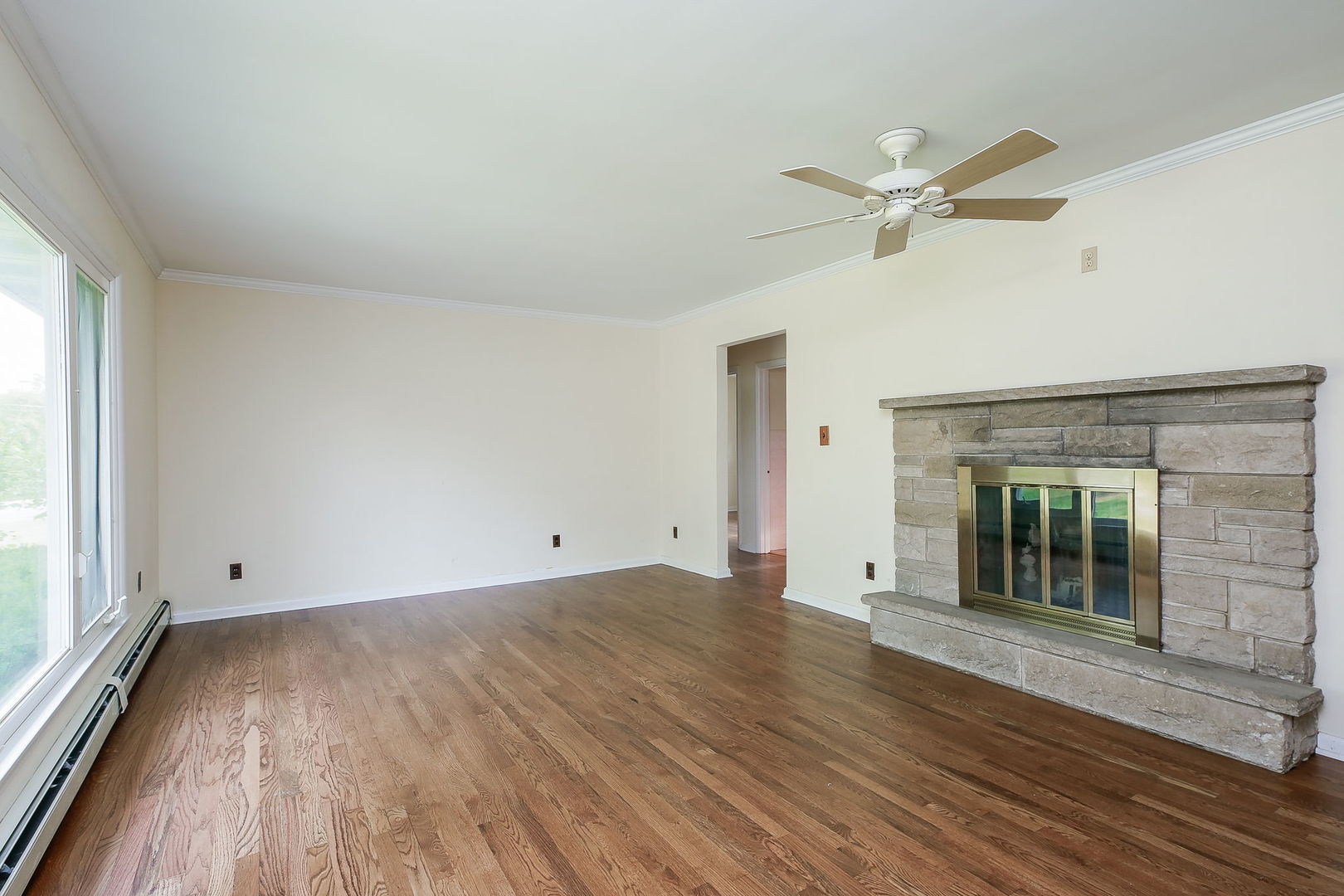 1170 South Broadway Road Montgomery, IL 60538 - Photo 5 of 25 wooden floor in an empty room with a window