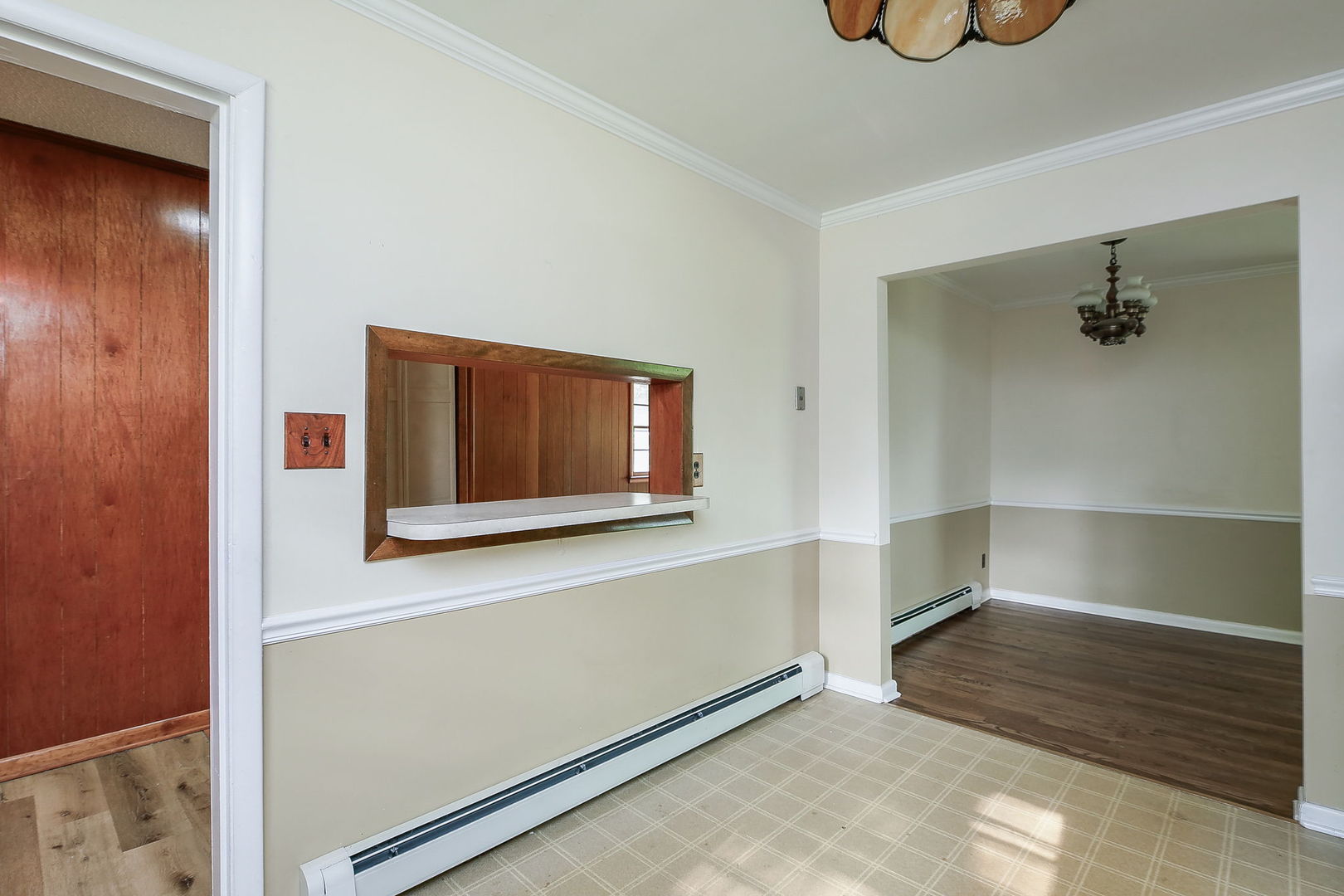 1170 South Broadway Road Montgomery, IL 60538 - Photo 9 of 25 a hallway with sliding door and chandelier