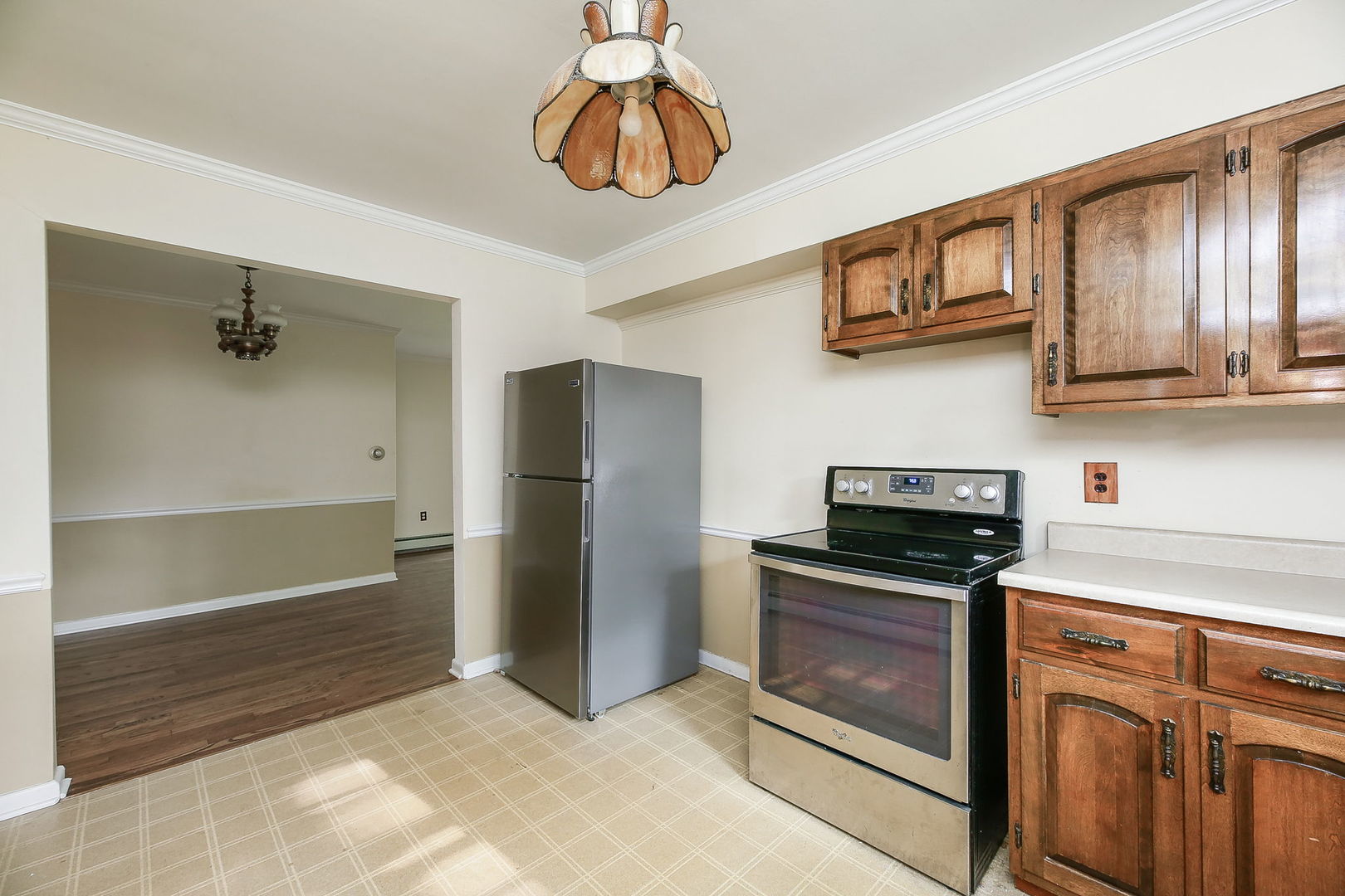 1170 South Broadway Road Montgomery, IL 60538 - Photo 10 of 25 a kitchen with stainless steel appliances granite countertop a refrigerator a stove and a sink
