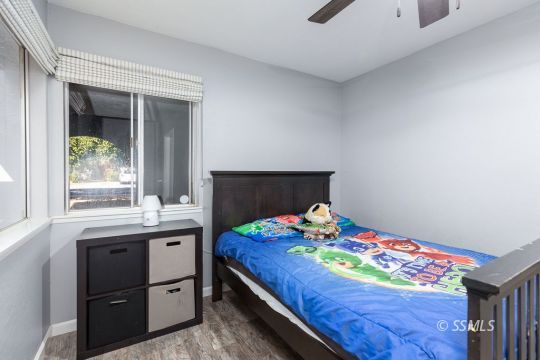 1116 South Allen Street Ridgecrest, CA 93555 - Photo 25 of 33 a bedroom with a bed and window