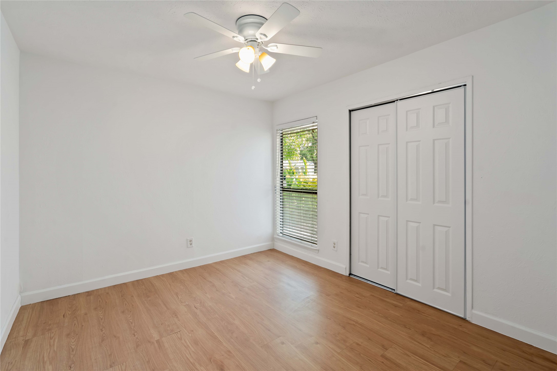 17415 North Barker Street Houston, TX 77084 - Photo 18 of 30 wooden floor in an empty room with a window