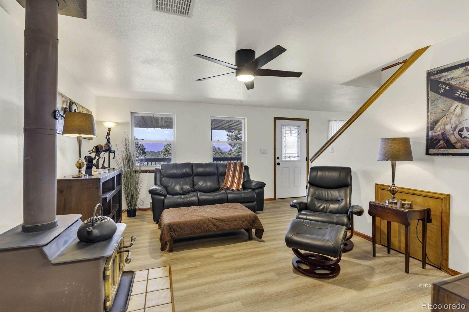 570 Rocky Ridge Road Westcliffe, CO 81252 - Photo 12 of 33 a living room with furniture and a flat screen tv