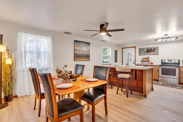 a view of a dining room with furniture and wooden floor