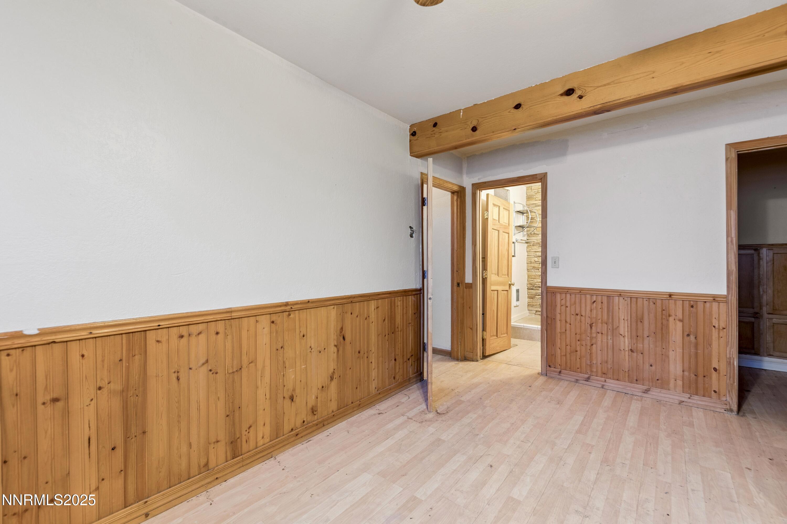 21565 Dortort Drive Reno, NV 89521 - Photo 18 of 25 a view of a room with wooden floor and windows