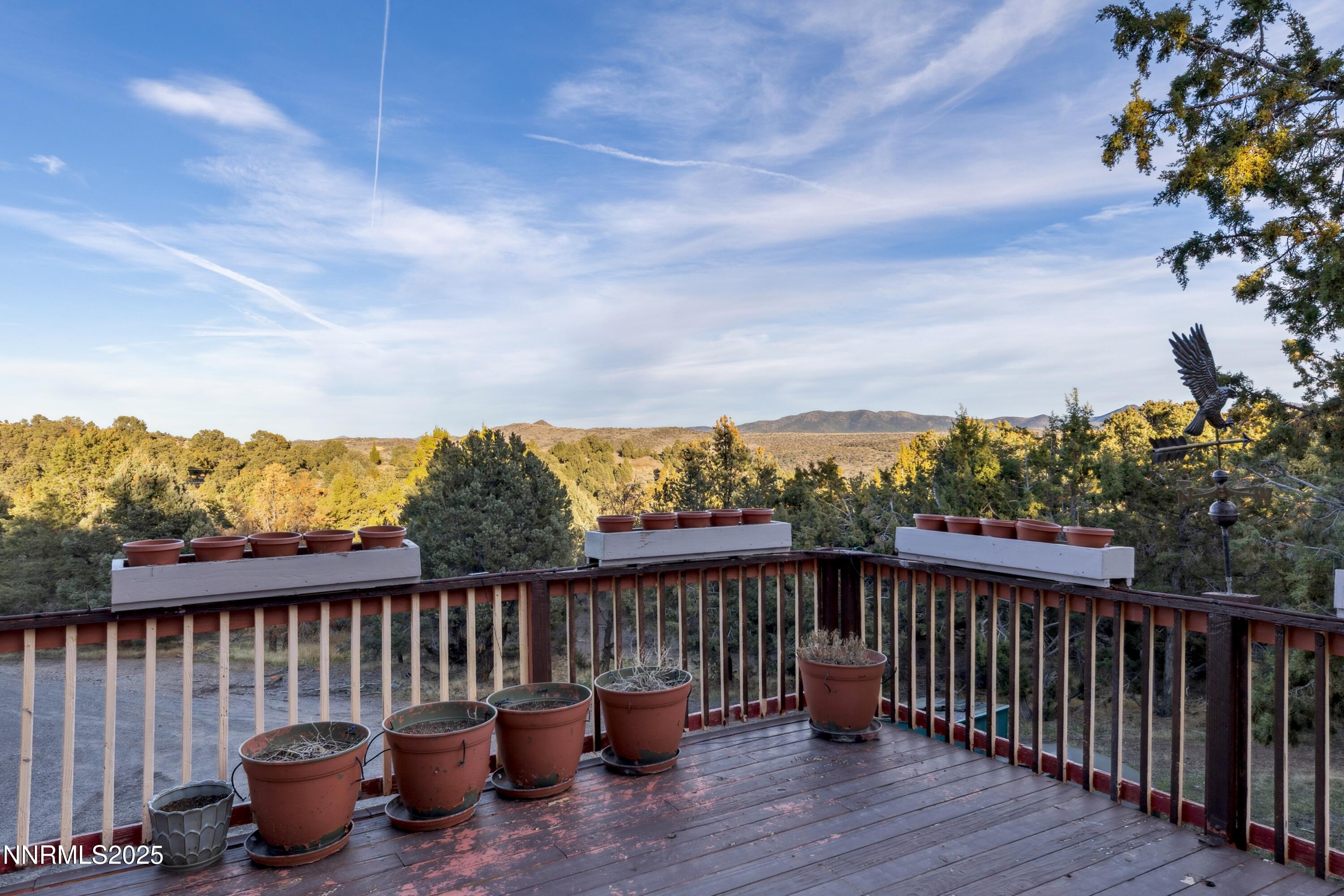 21565 Dortort Drive Reno, NV 89521 - Photo 2 of 25 a view of a two chairs on the roof deck