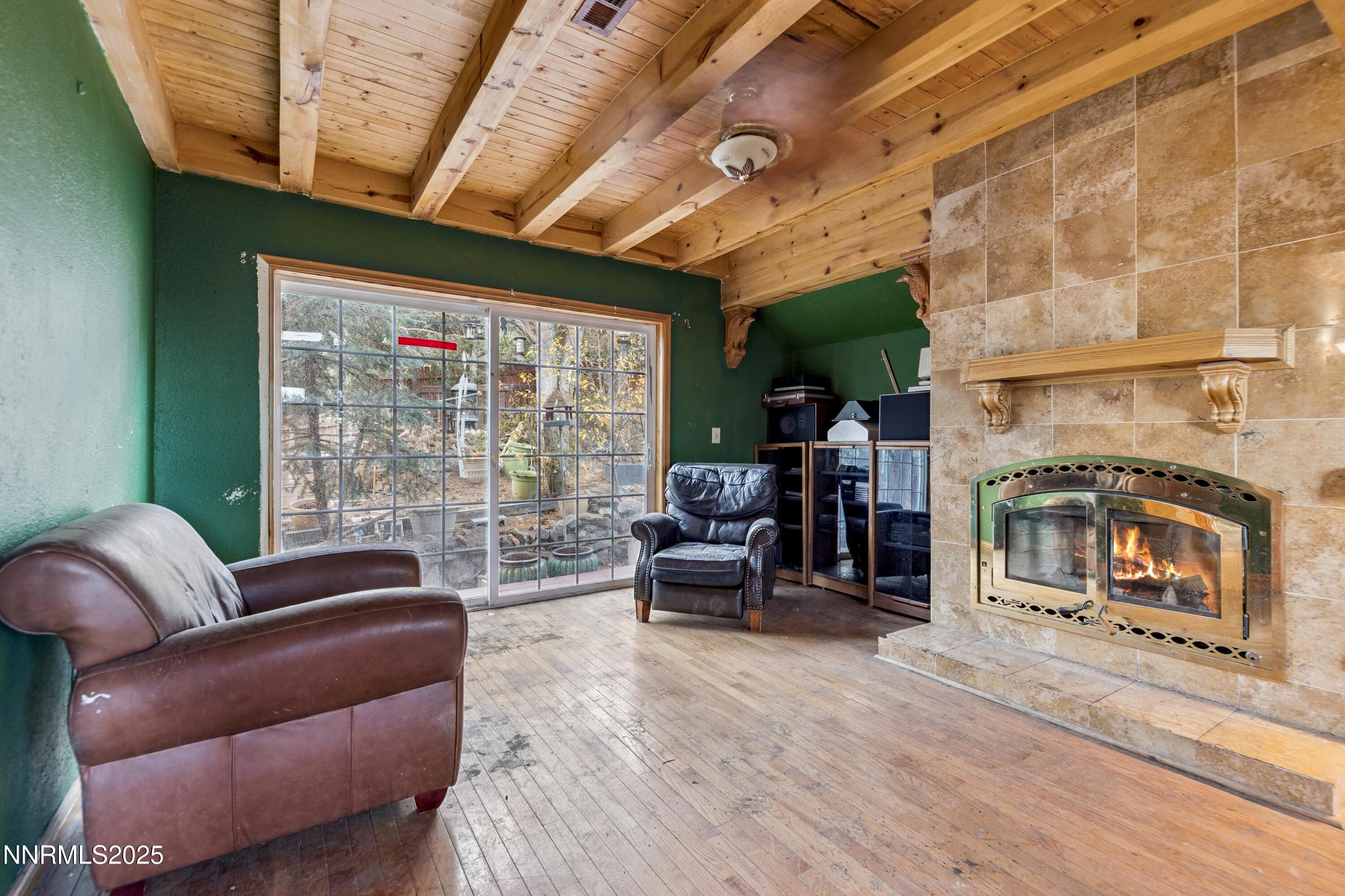 21565 Dortort Drive Reno, NV 89521 - Photo 6 of 25 a living room with furniture and a fireplace