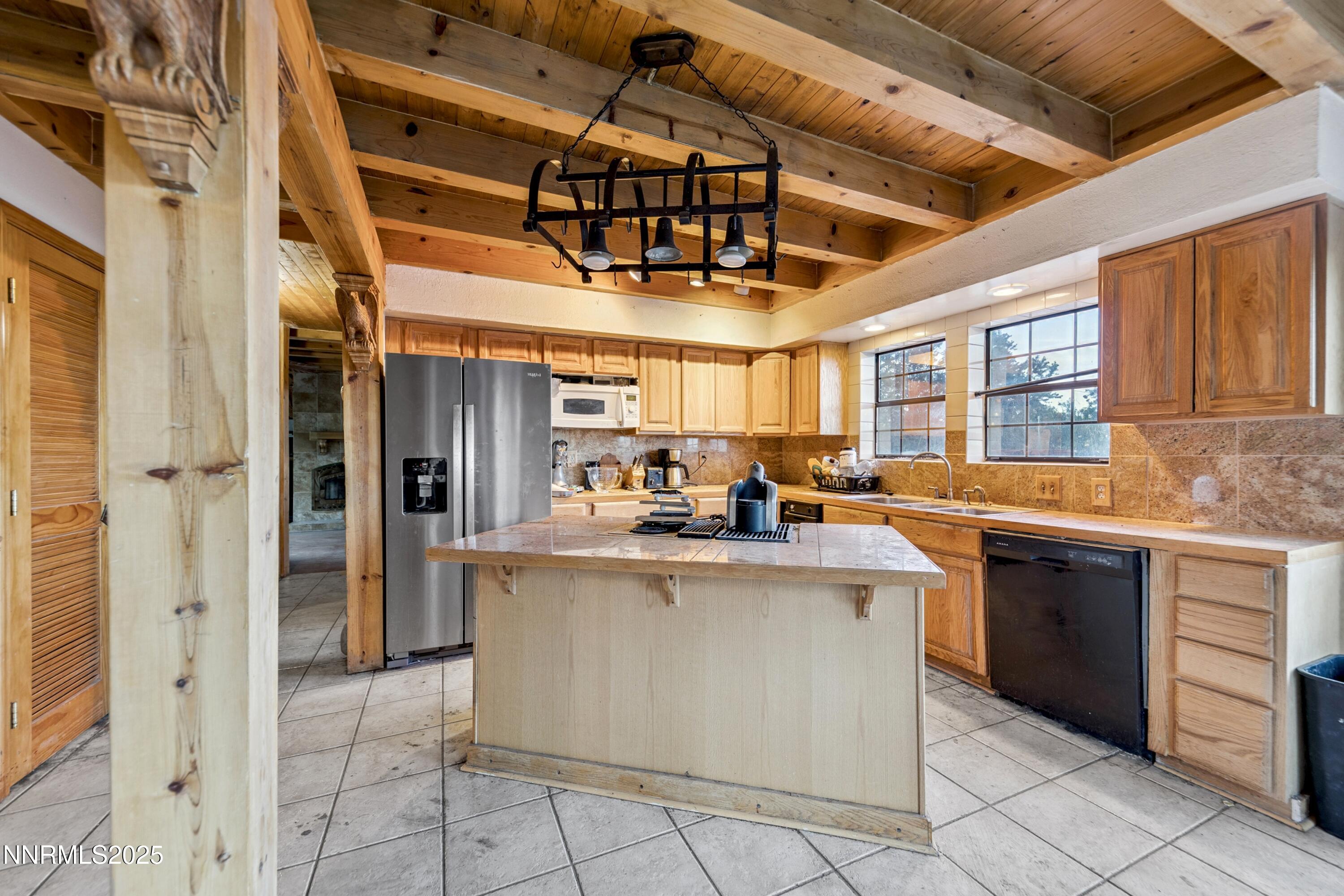 21565 Dortort Drive Reno, NV 89521 - Photo 8 of 25 a kitchen with stainless steel appliances granite countertop a sink and cabinets