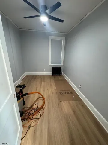 an empty room with wooden floor