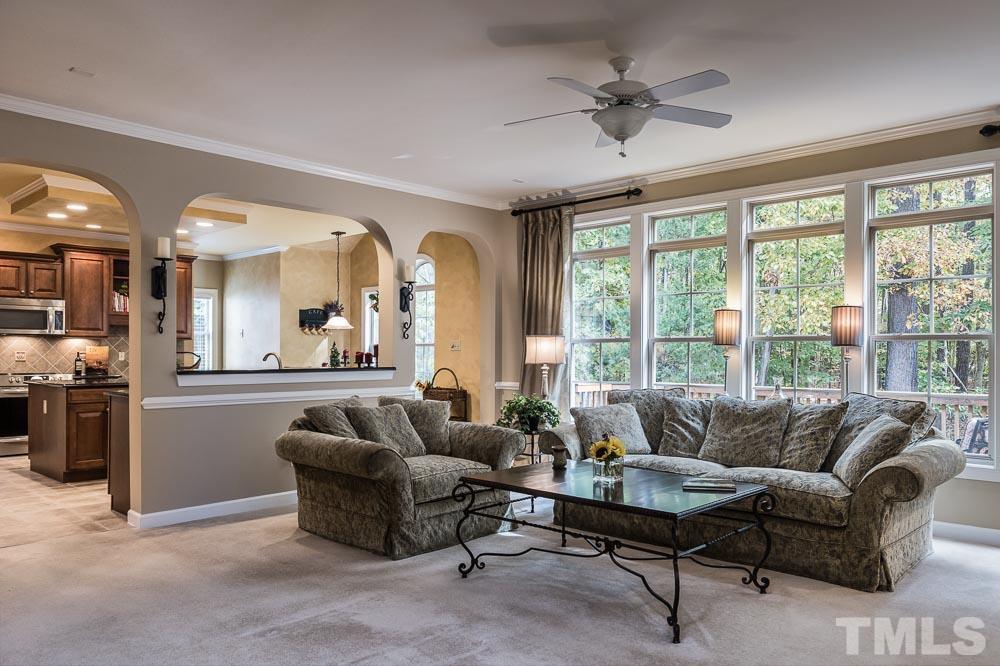8236 Clarks Branch Drive Raleigh, NC 27613 - Photo 8 of 25 a living room with furniture and a large window