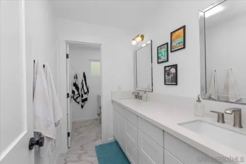 a bathroom with a sink and mirror