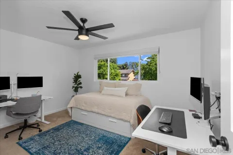 a bedroom with a workspace