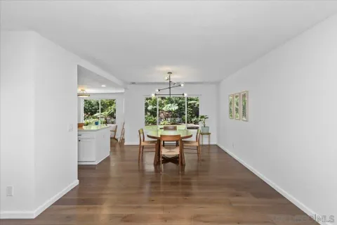 a dining room with furniture window wooden floor