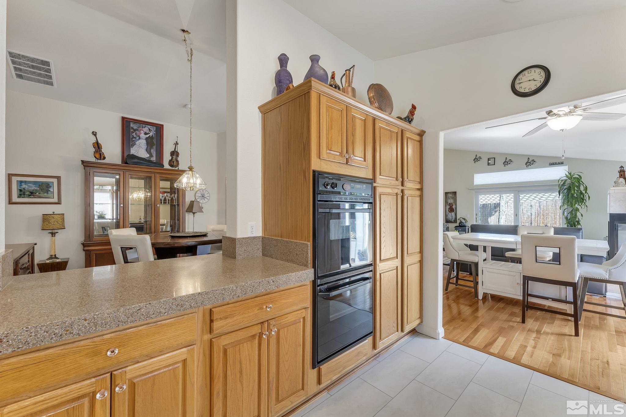 2560 Granite Springs Road Reno, NV 89519 - Photo 14 of 33 a kitchen with stainless steel appliances granite countertop a refrigerator and a sink